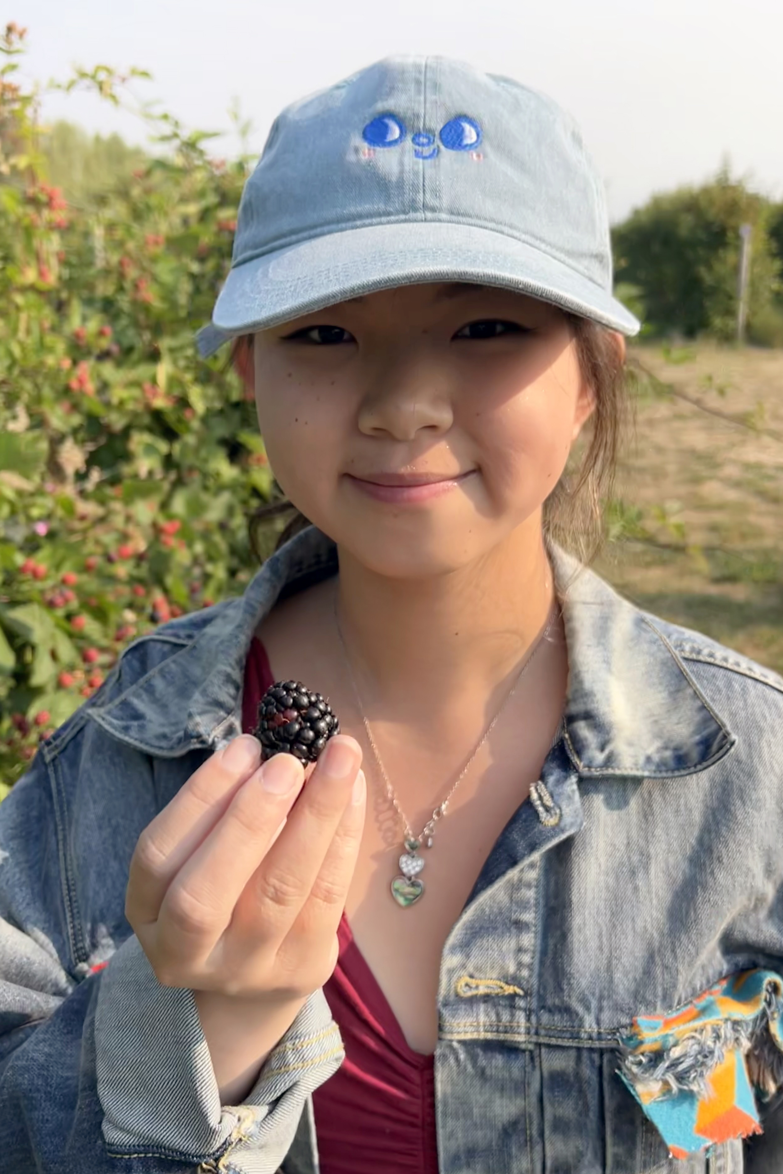 Kati Khov portrait holding a blackberry