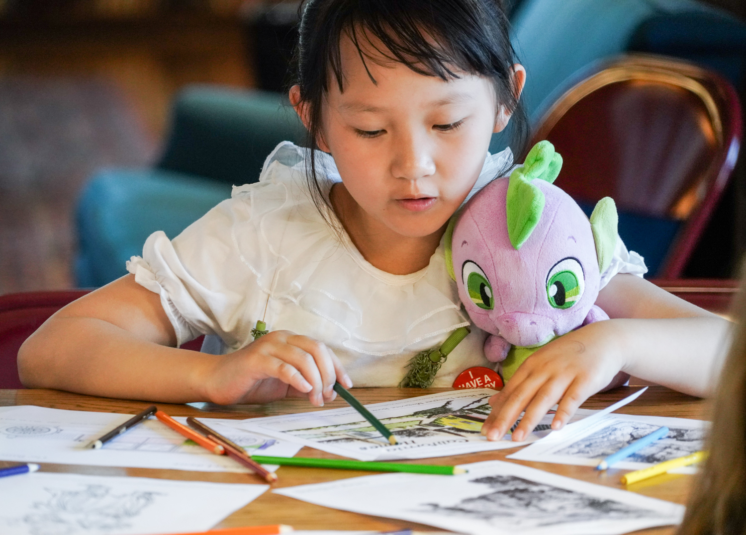 A young guest colors in Morrison Library on Cal Day, April 21, 2018. (Photo by Jami Smith for the UC Berkeley Library)