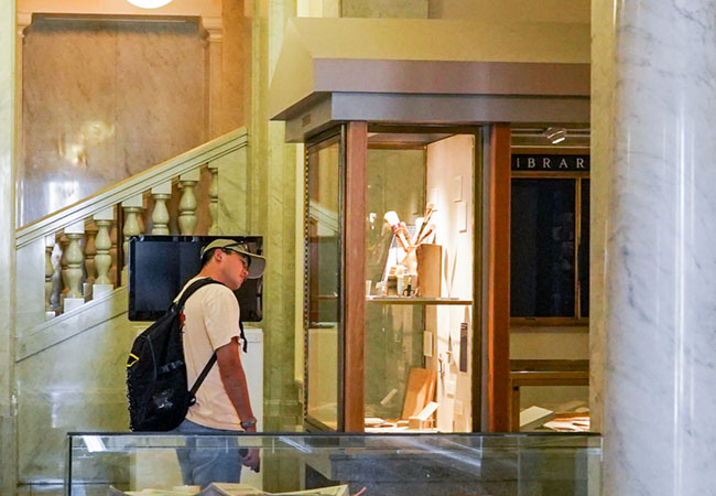 Visitor looks at exhibit case